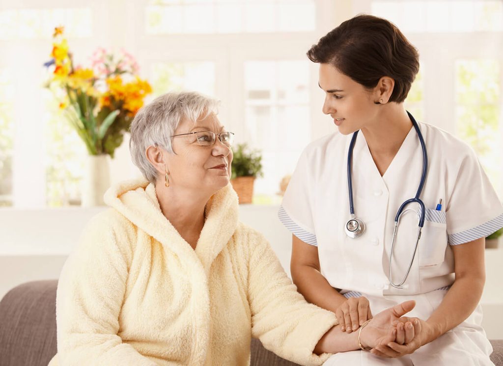 Doctor sitting with a patient